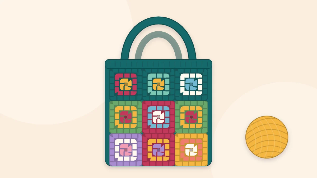 A tote bag made of colorful granny squares arranged in a grid, with two handles
