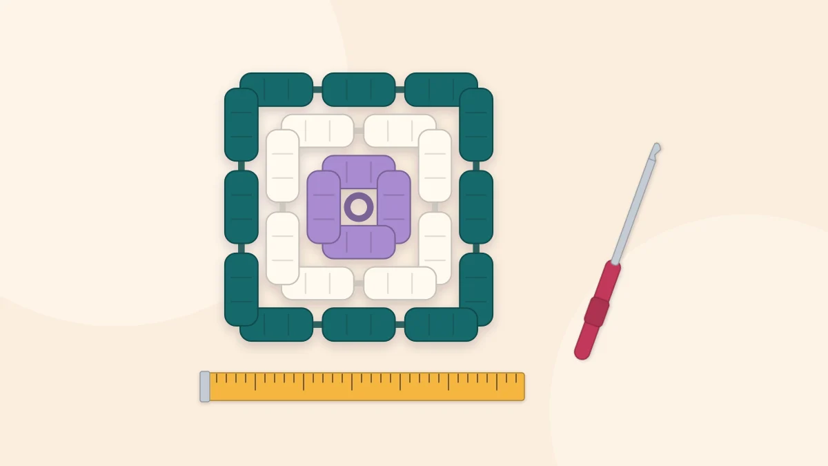 A granny square lying flat beside a measuring tape and a crochet hook