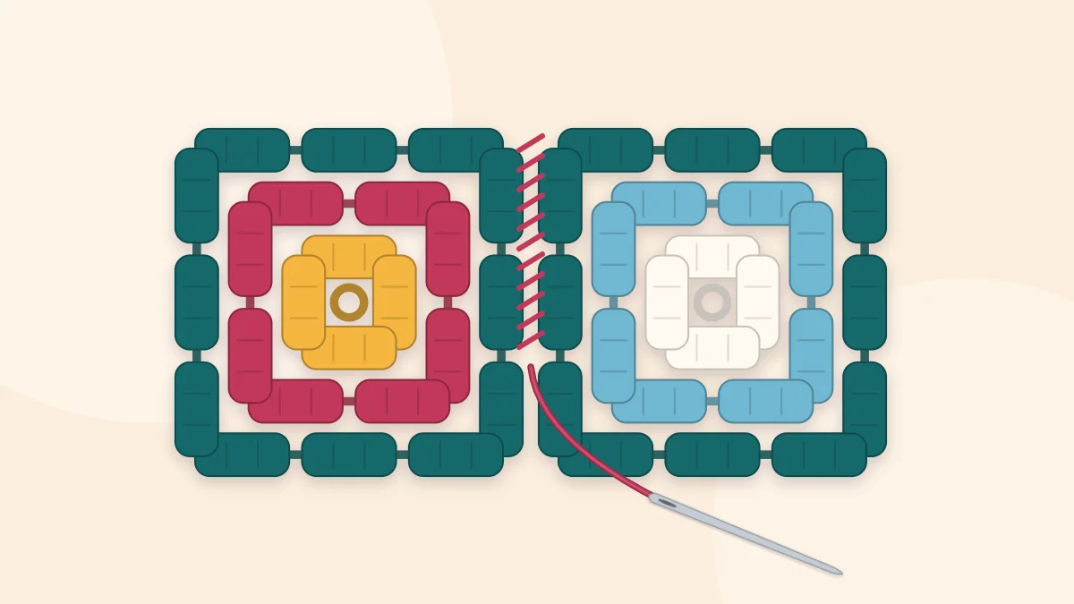 Two granny squares being sewn together along one edge with a yarn needle