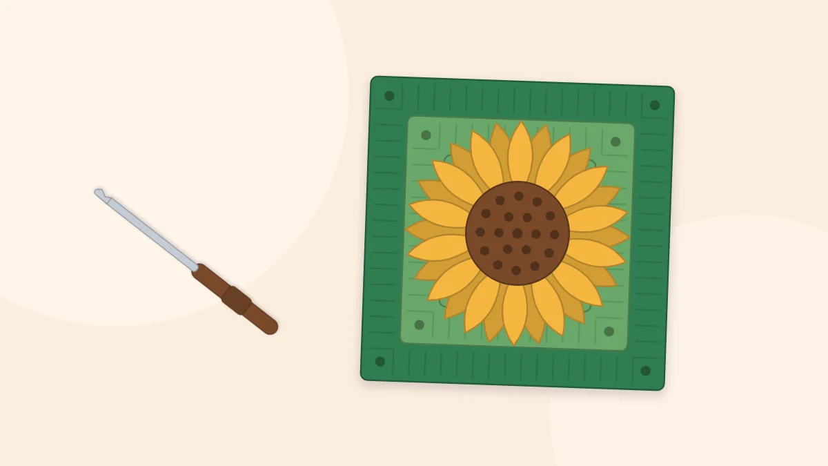 A sunflower granny square with a brown center, yellow pointed petals and a green frame, with a crochet hook beside it